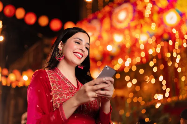 A stylish woman beside vibrant slot machines displaying glowing sevens, showcasing the variety of top slots at JILIDD.