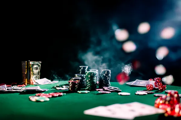 A close-up shot of golden coins falling around a spinning roulette wheel, representing immersive casino action at JILIDD.