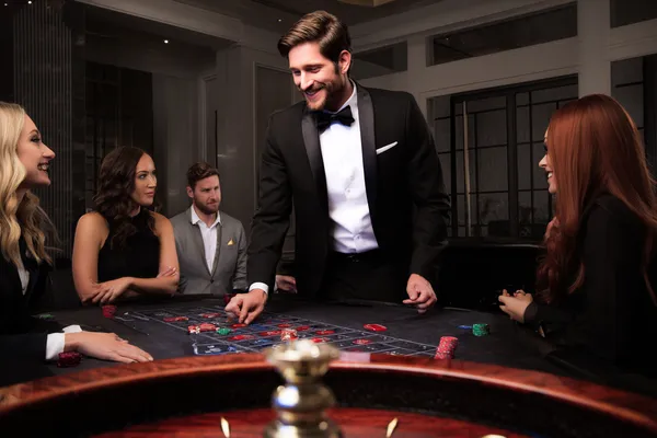 A person using their device against a moody casino-themed background, illustrating the smooth re-entry process at JILIDD.